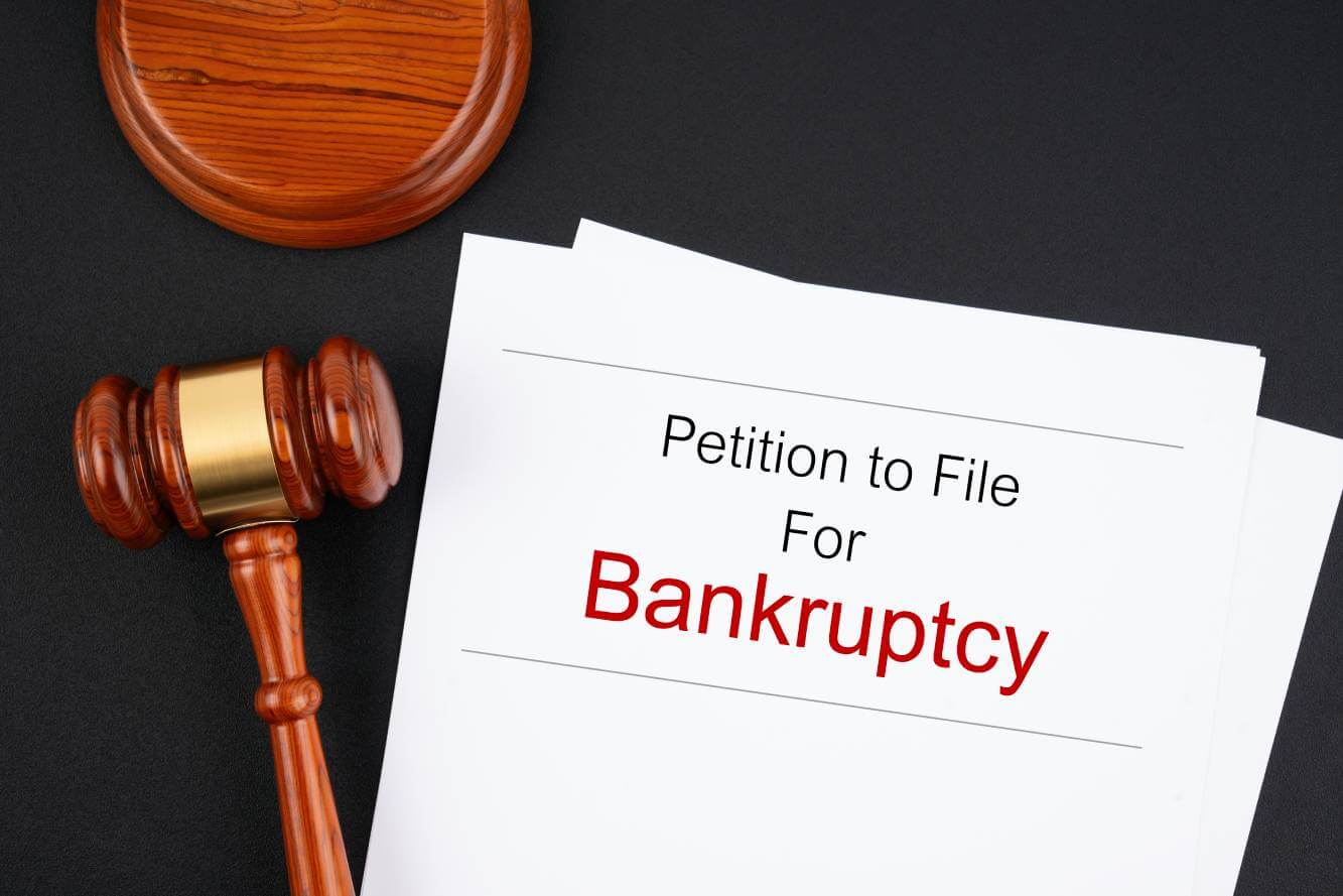 petition to file for bankruptcy setting on a judge's desk