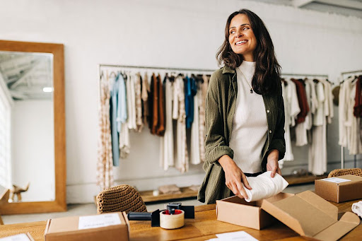 Business woman packaging product