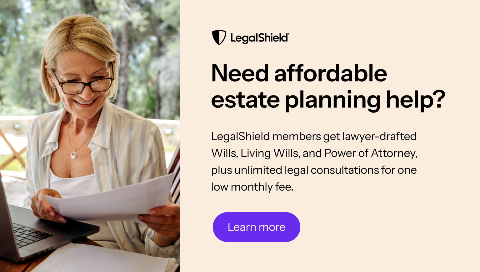 A woman with black glasses considers estate planning options.