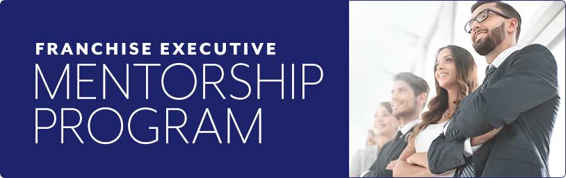 Group of confident business professionals standing with arms crossed beside text reading Franchise Executive Mentorship Program.