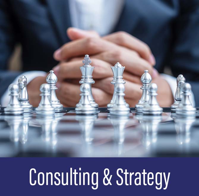 Close-up of silver chess pieces on a board with a person in a suit clasping hands in the background, below text reads Consulting & Strategy.