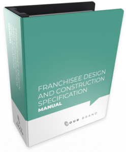 Thick binder titled 'Franchisee Design and Construction Specification Manual' with a teal and white cover.