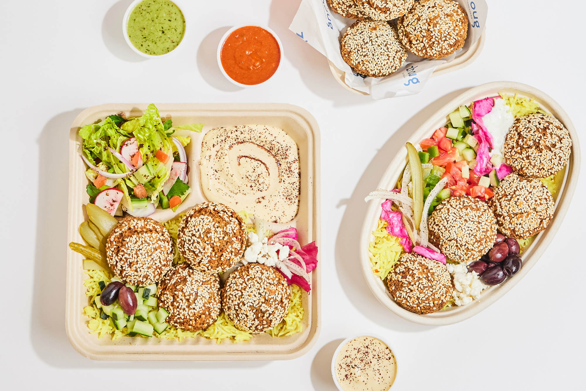 Big spread with a falafel bowl and platter.
