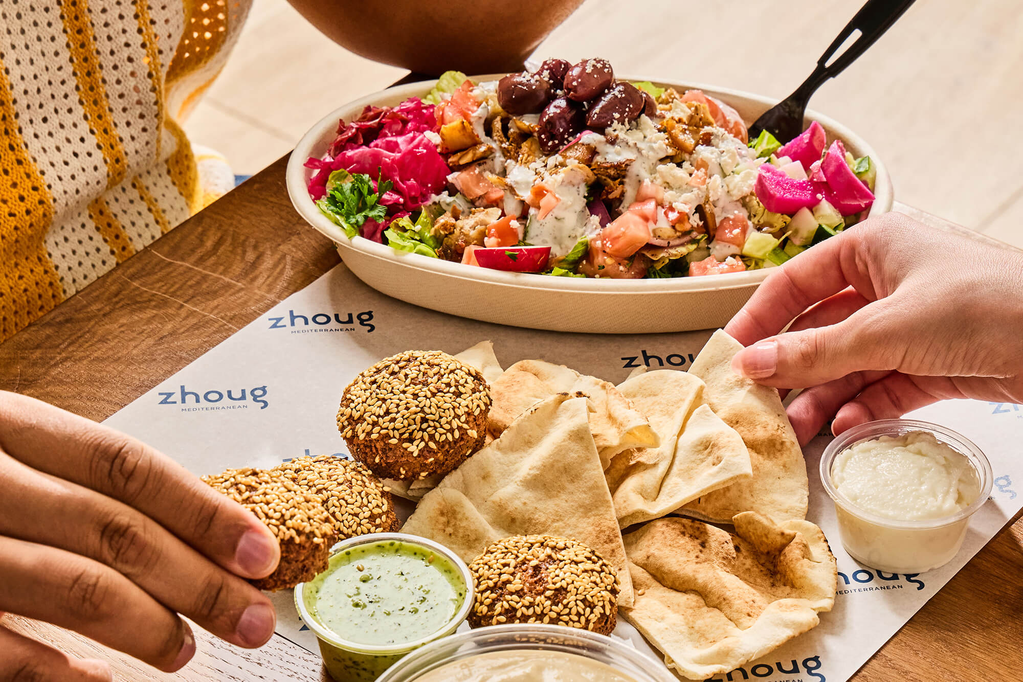 Close up image of a spread of Zhoug Mediterranean food.