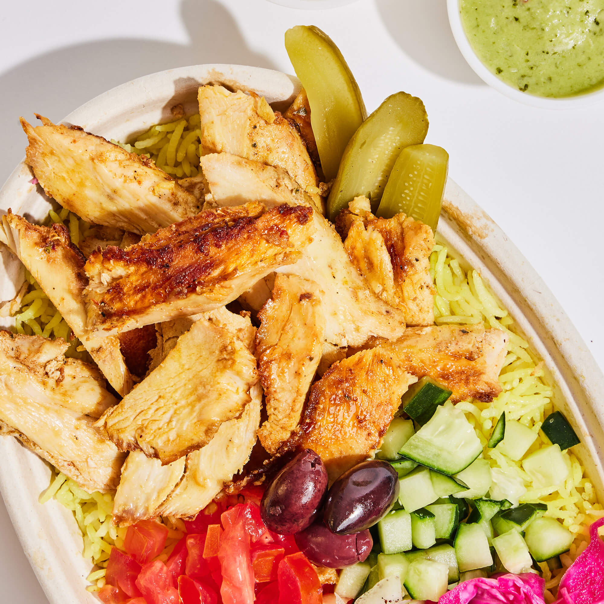 Close up of a chicken shawarma bowl.
