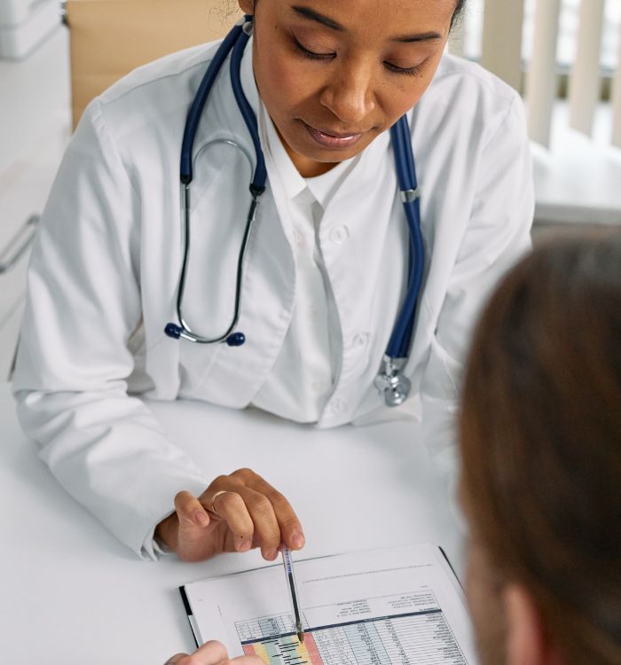 A female doctor is engaged in conversation with a patient.