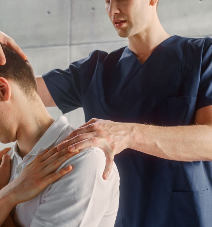 A man receives a medical examination from a doctor