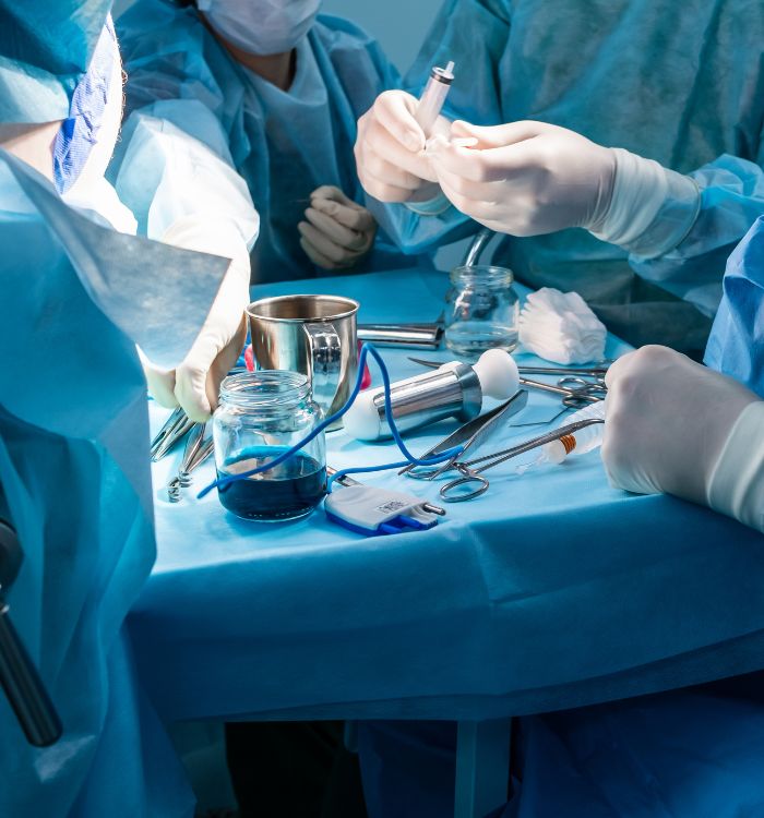 A group of doctors working on a patient.