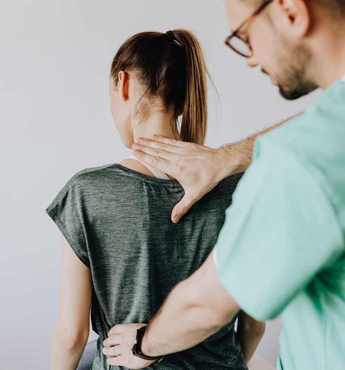 A man massaging a woman's back.