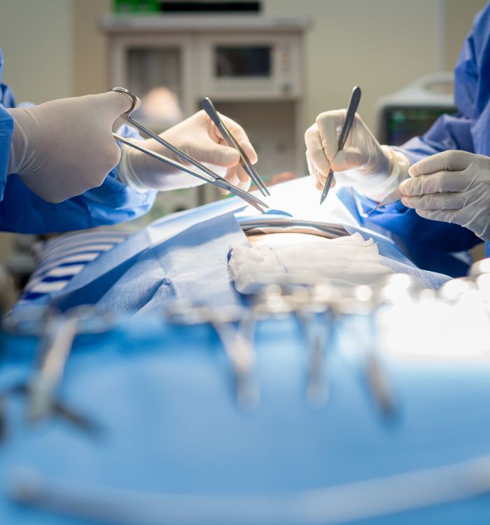 A group of doctors working on a patient.