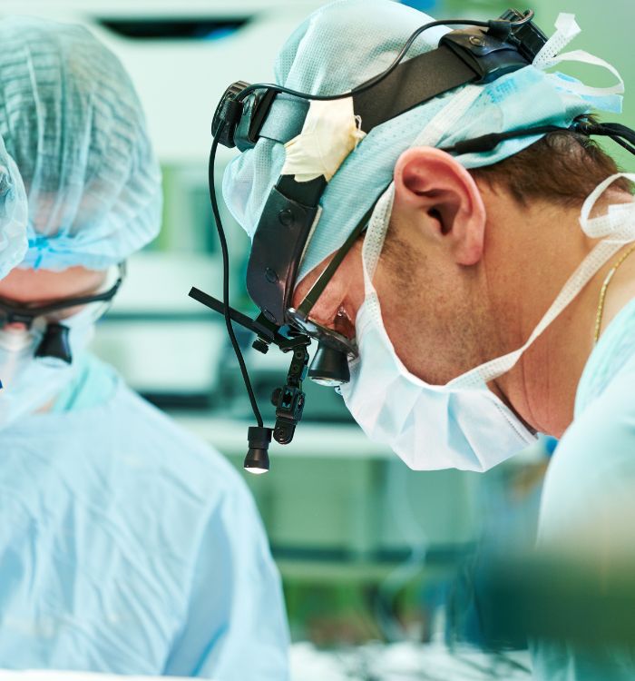 A man wearing a surgical mask and hat.