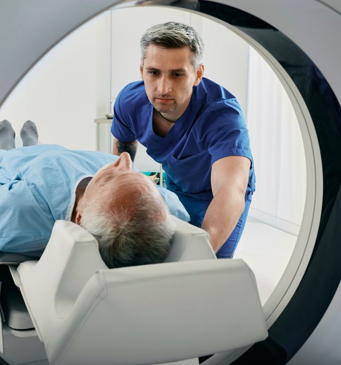 A man is in a machine that is scanning his head.