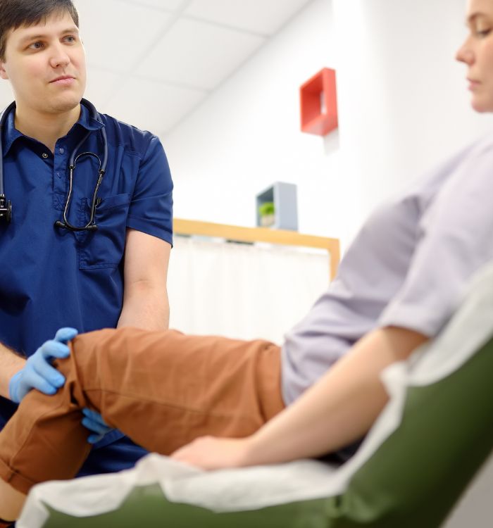 A man in a blue shirt and a woman in a brown shirt are talking to each other.