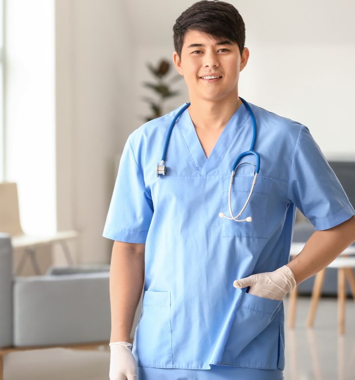 A man wearing a blue shirt and white gloves.