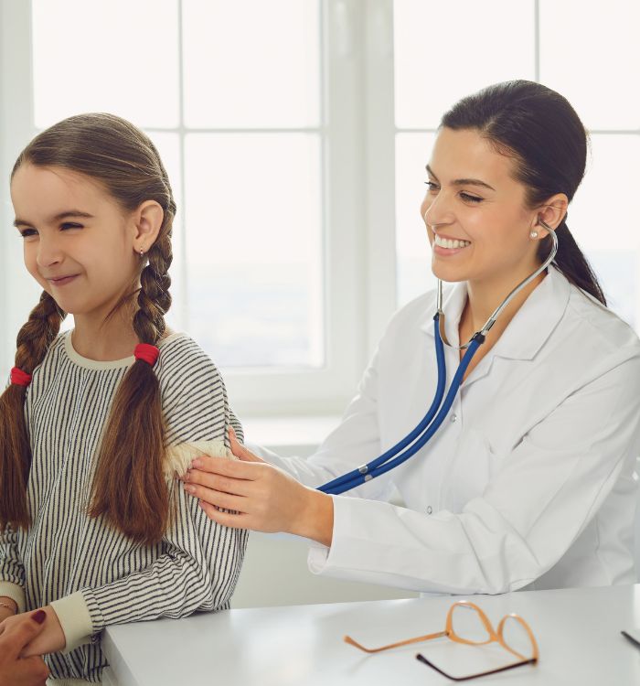 A woman wearing a white coat and holding a stethoscope.