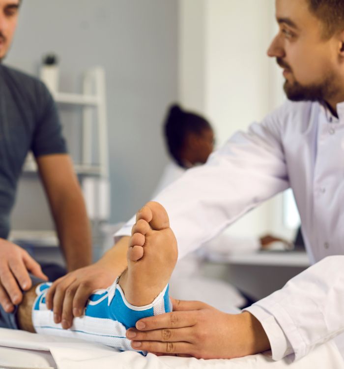 A man with a blue shoe on his foot.