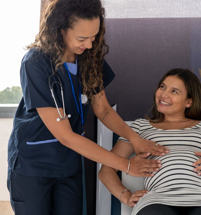 A woman with a stomach that is showing her belly button.