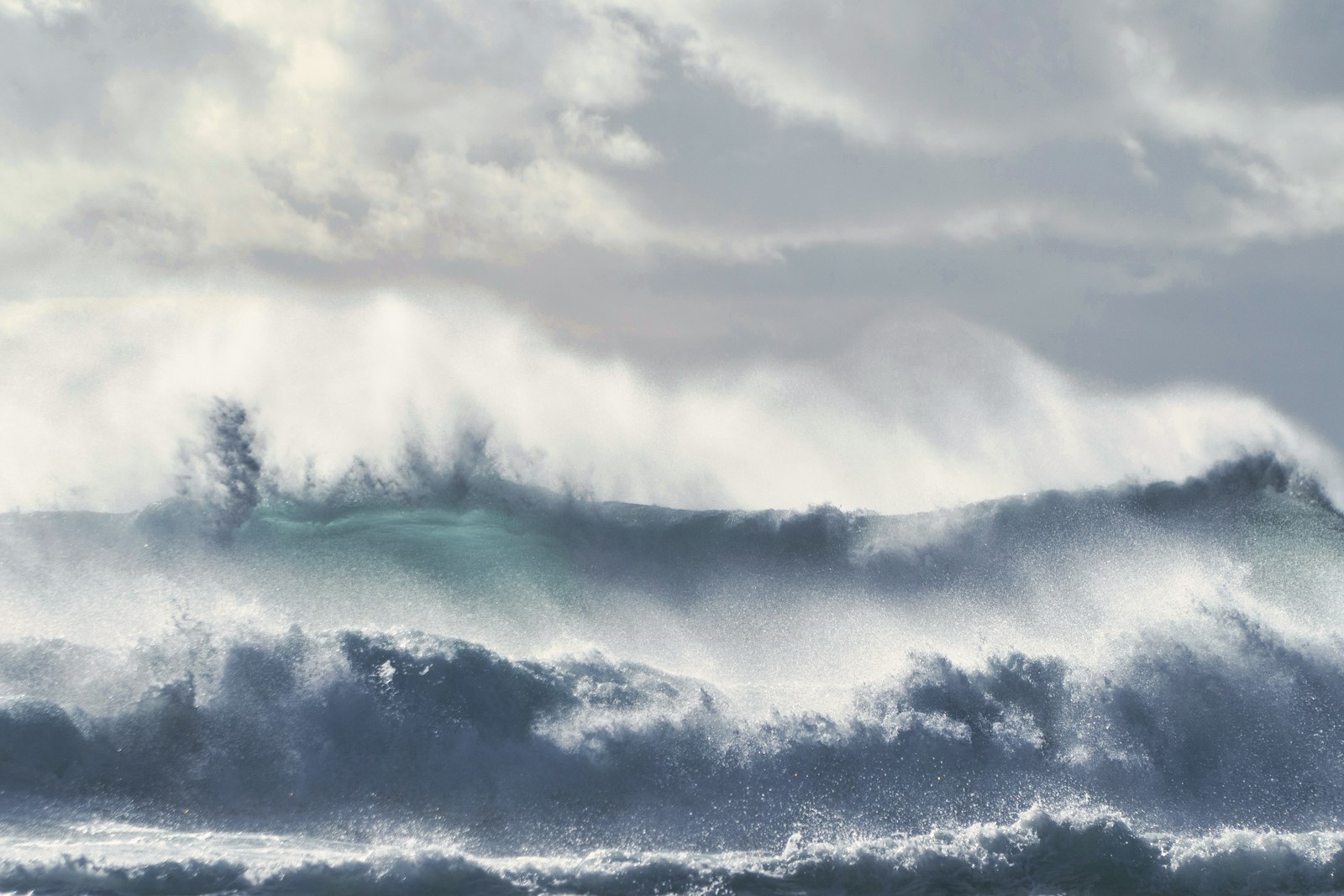Wild North Sea waves and sea spray under a grey sky