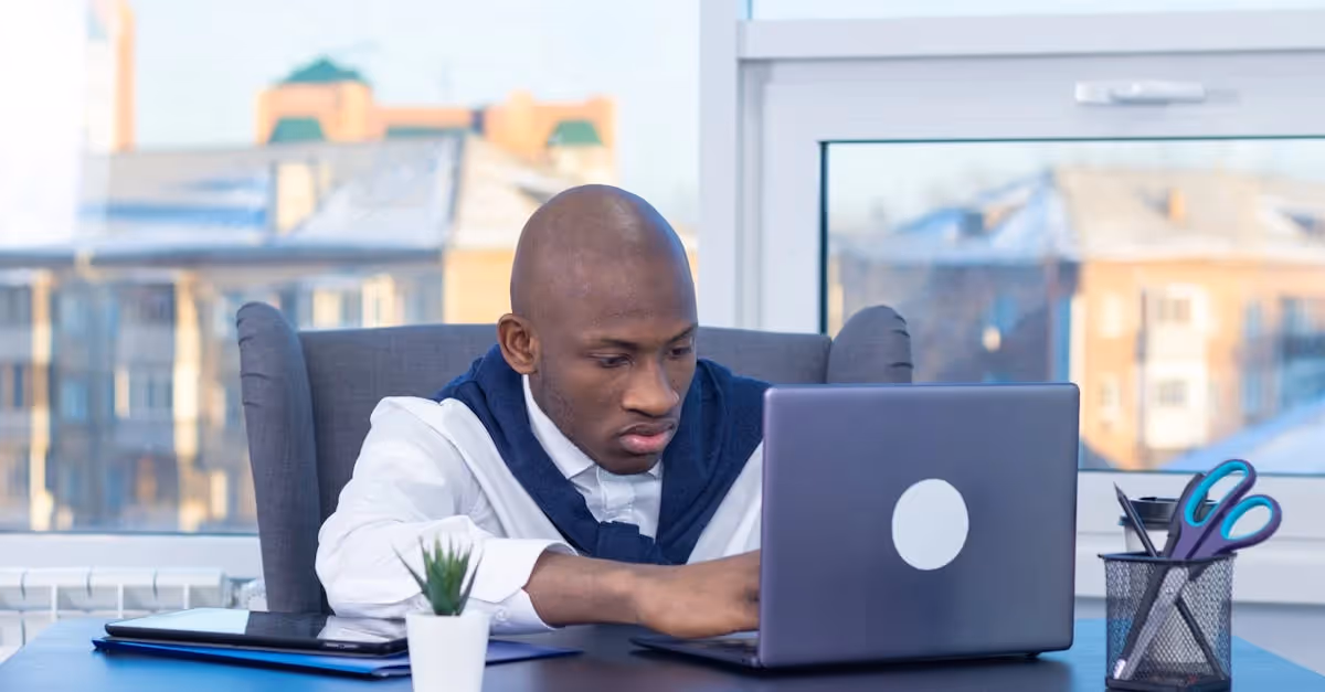 man working at laptop