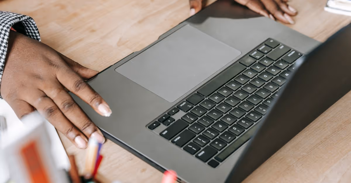 laptop and hand