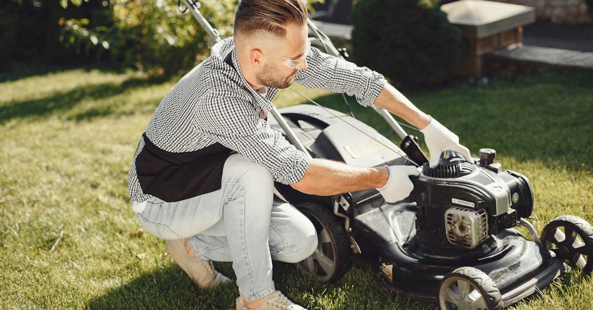 man at lawnmower