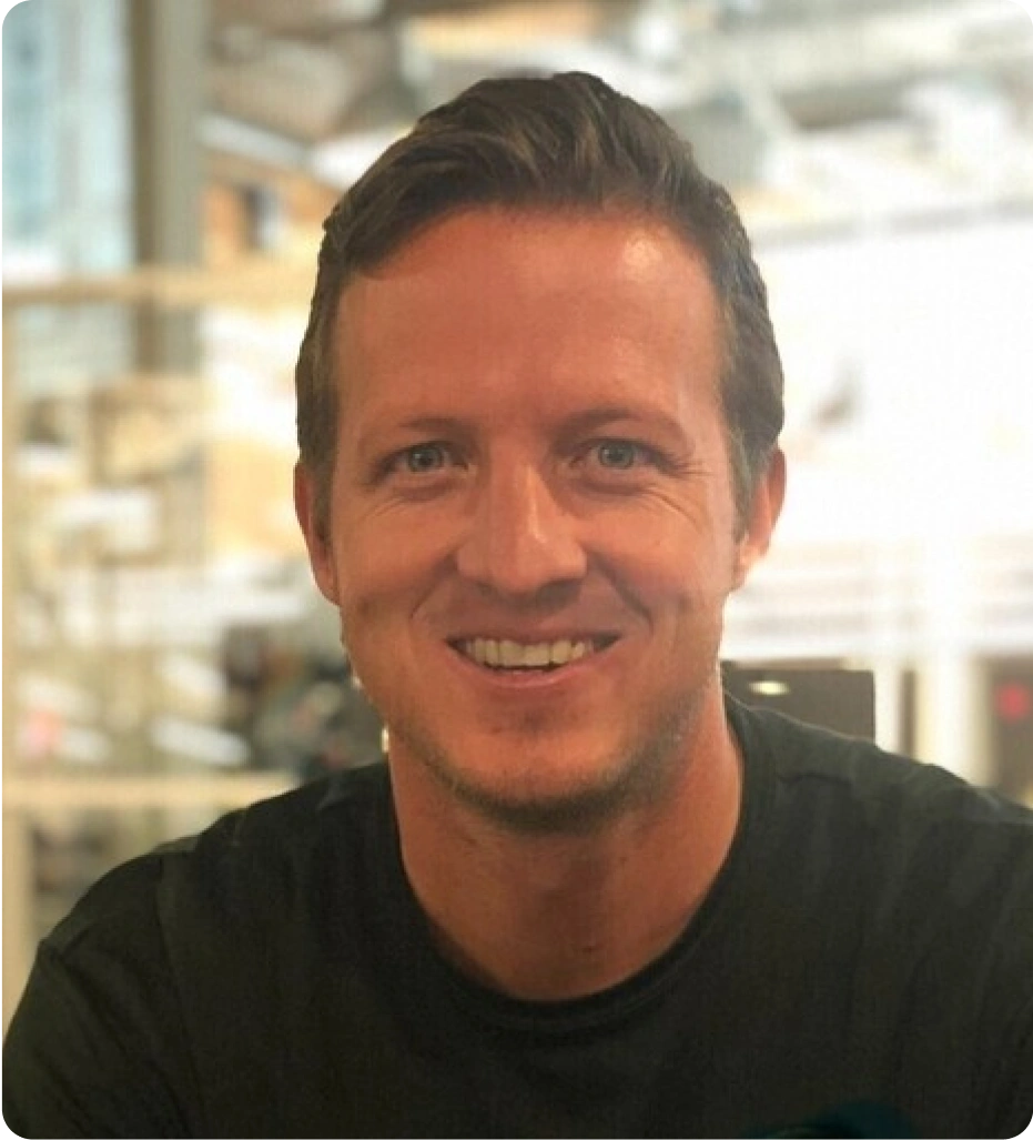 Headshot of Michael Shields, quoted in this article on benchmarks report