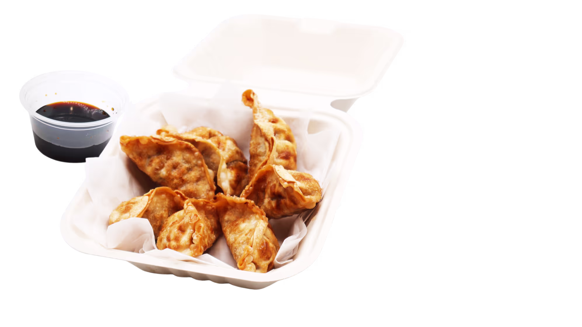 Takeout container with fried dumplings and a cup of dark soy dipping sauce.