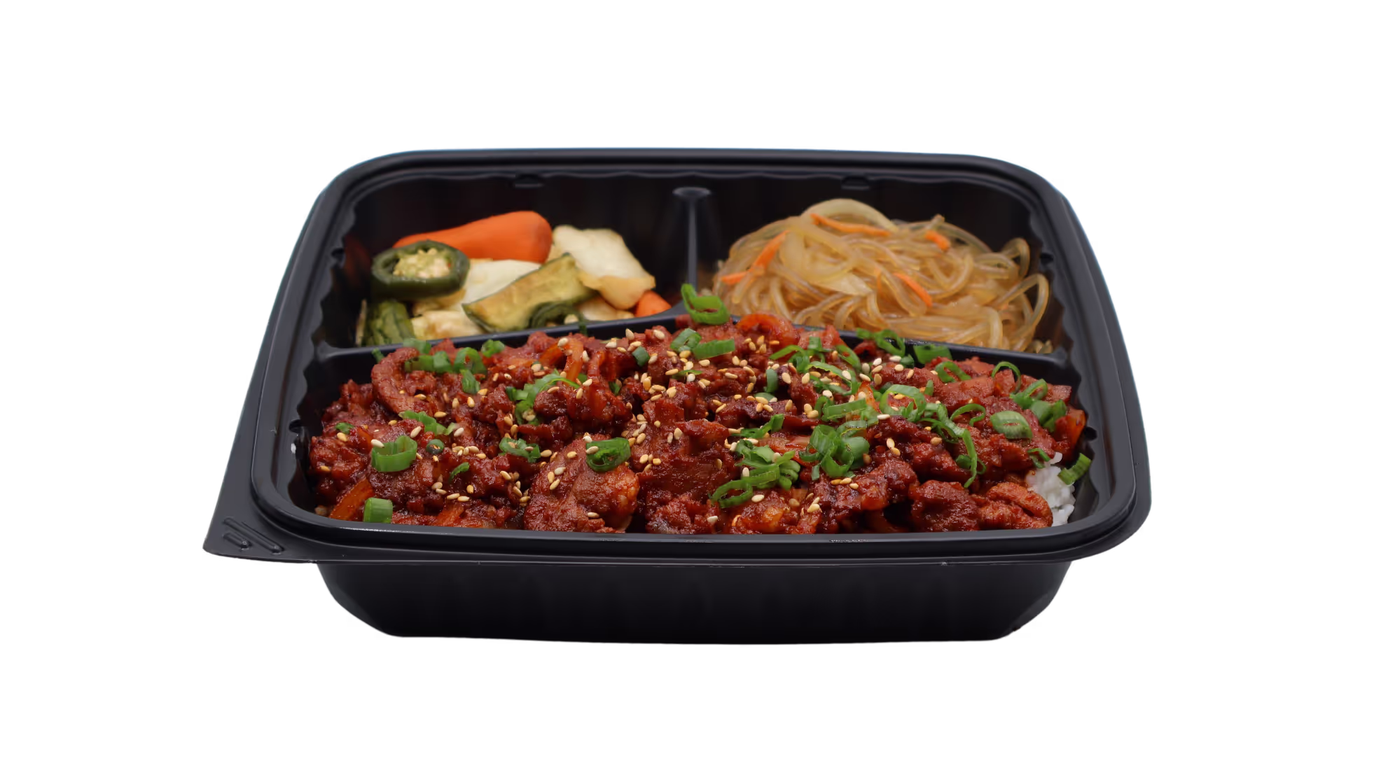 Black takeout tray with spicy marinated meat on rice, glass noodles, and mixed vegetables.