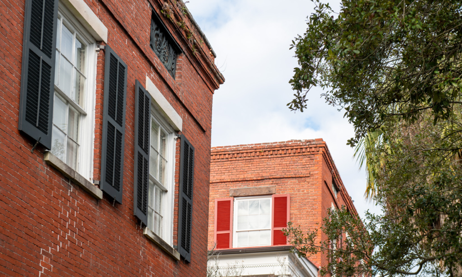 A brick building with white trimAI-generated content may be incorrect.