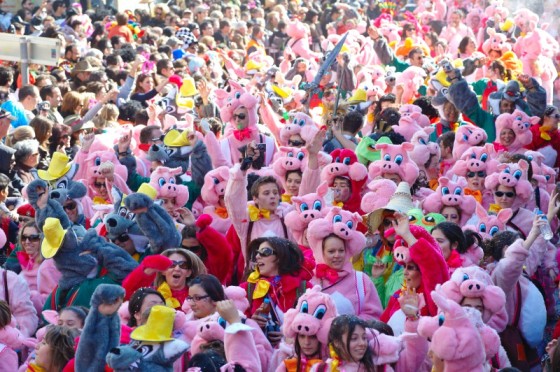 People celebrating Apokries in Greece with colorful costumes