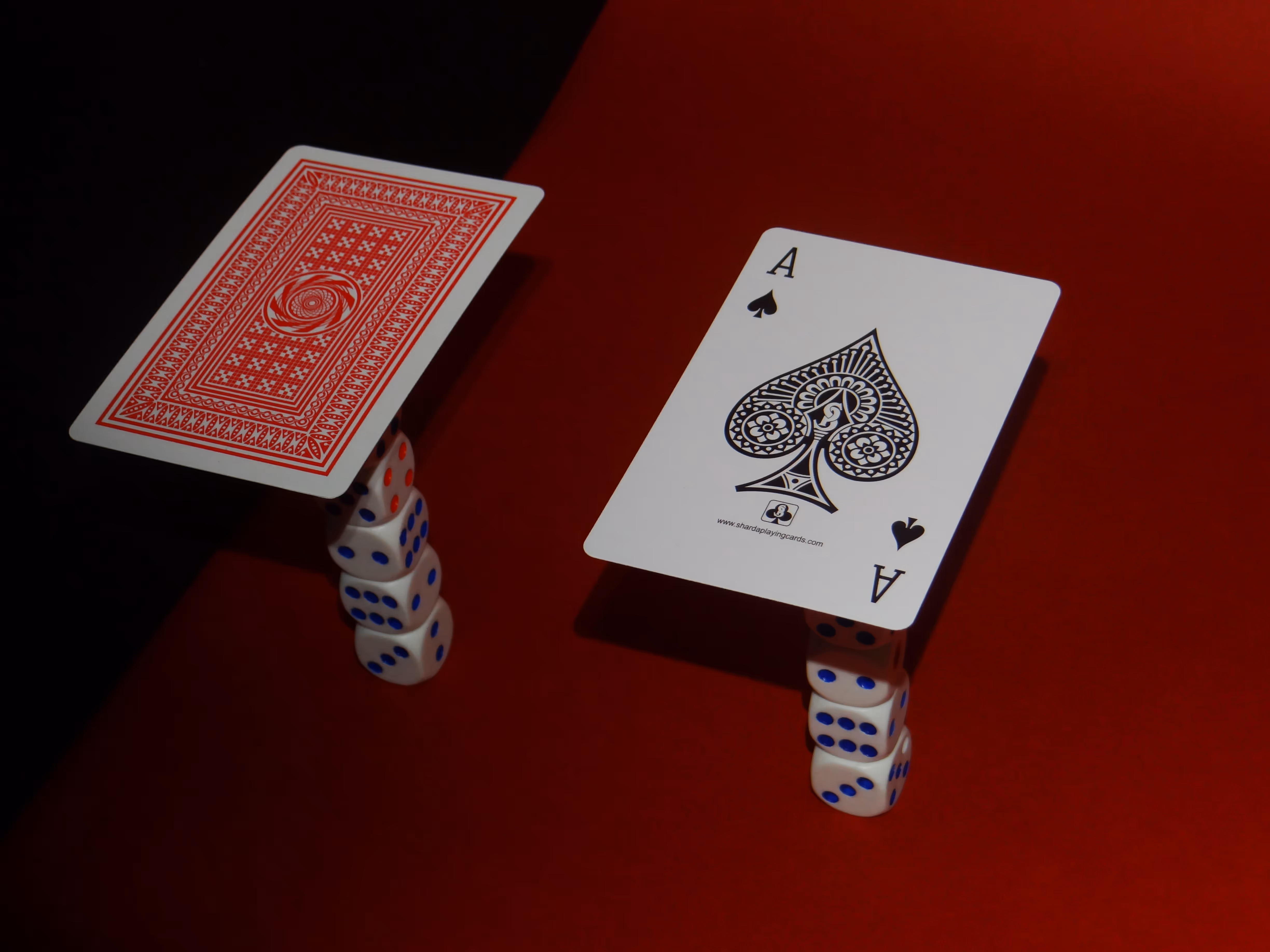 Captivating Mood shot of The Club Cards' Sharda 51 Playing Cards on sets of dice.