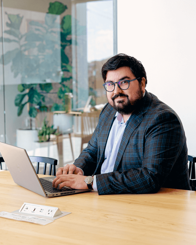 A smiling woman with glowing, healthy skin in natural light, representing wellness and positive dermatology results for Affiliated Dermatology in Richardson.