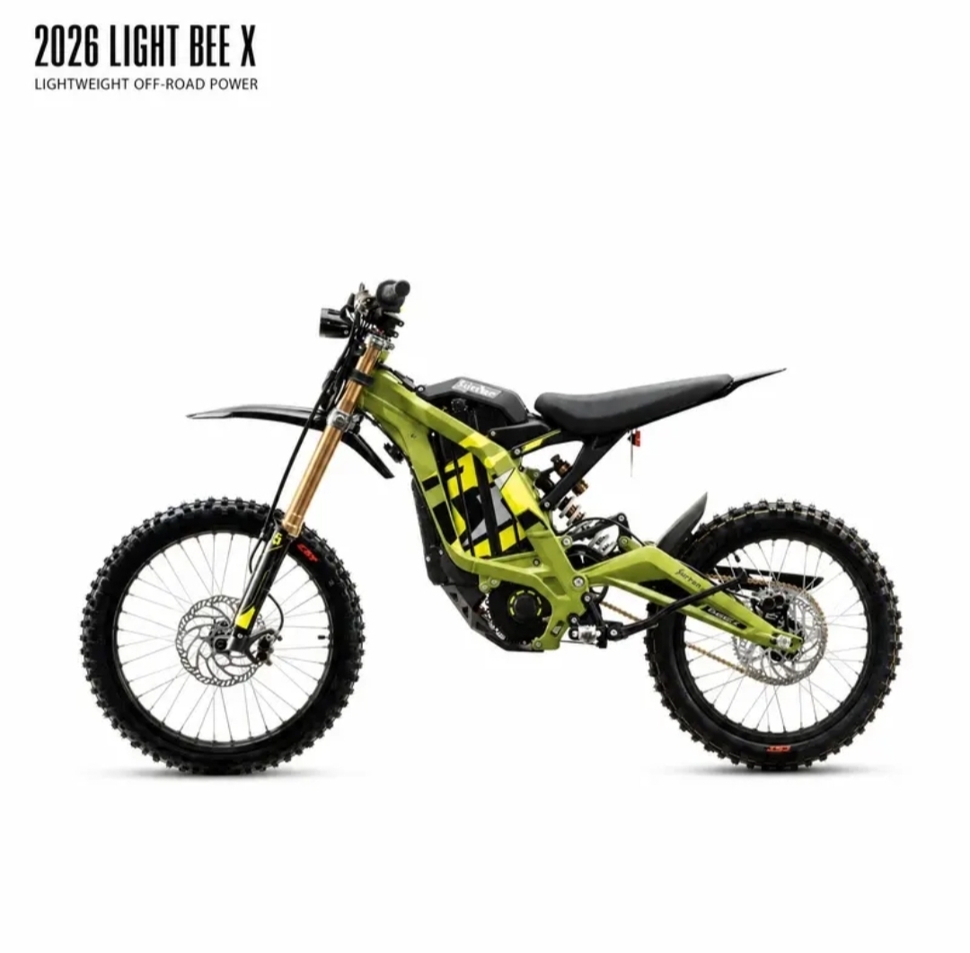 Side view of a 2026 Light Bee X lightweight off-road electric dirt bike with green and black frame and knobby tires.
