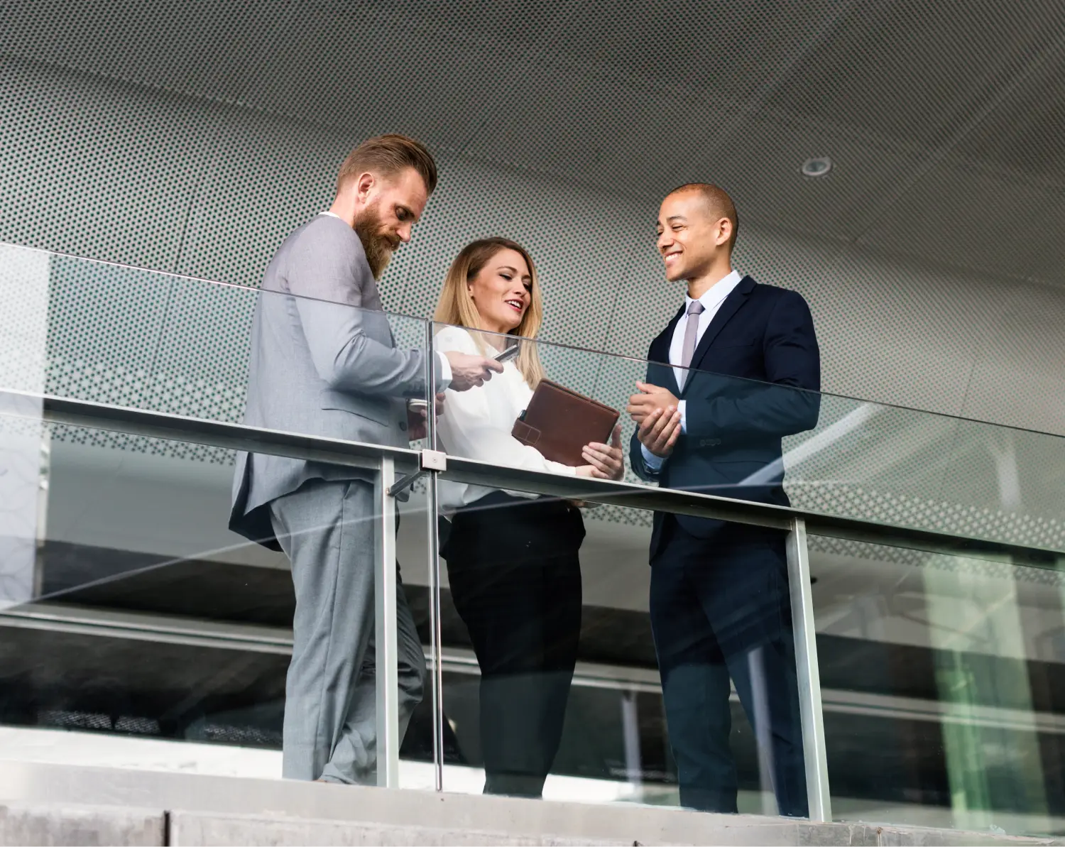 young professionals conversing on a balcony