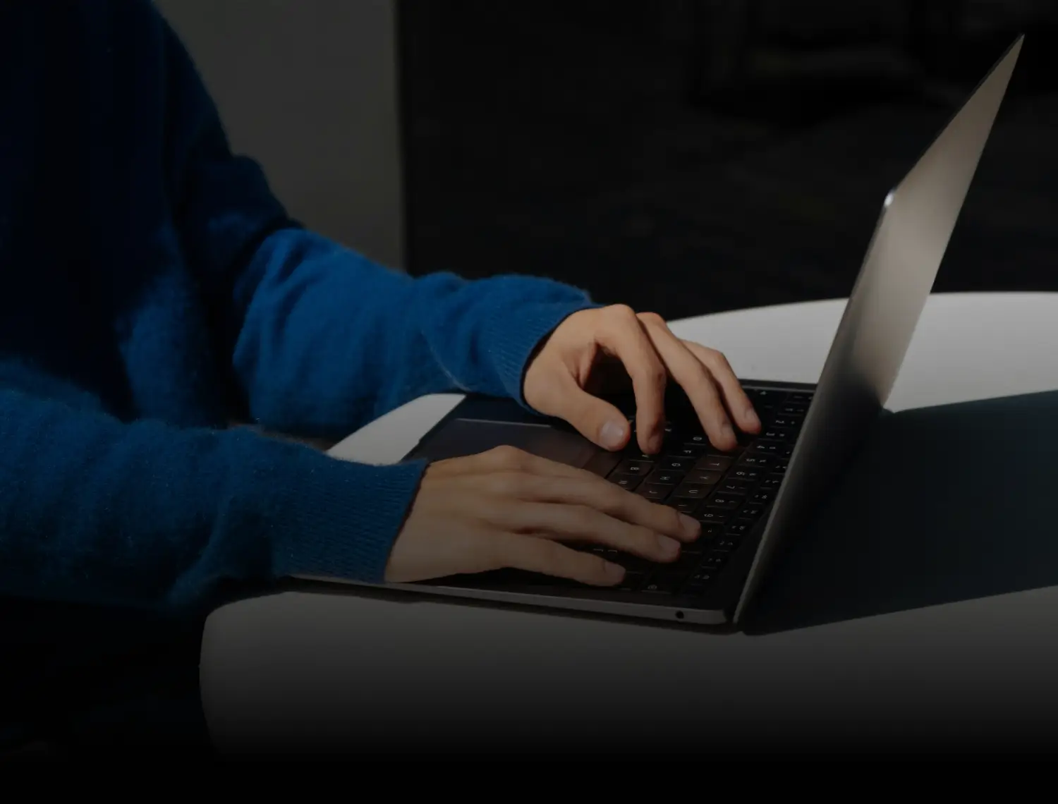 hands typing on a keyboard