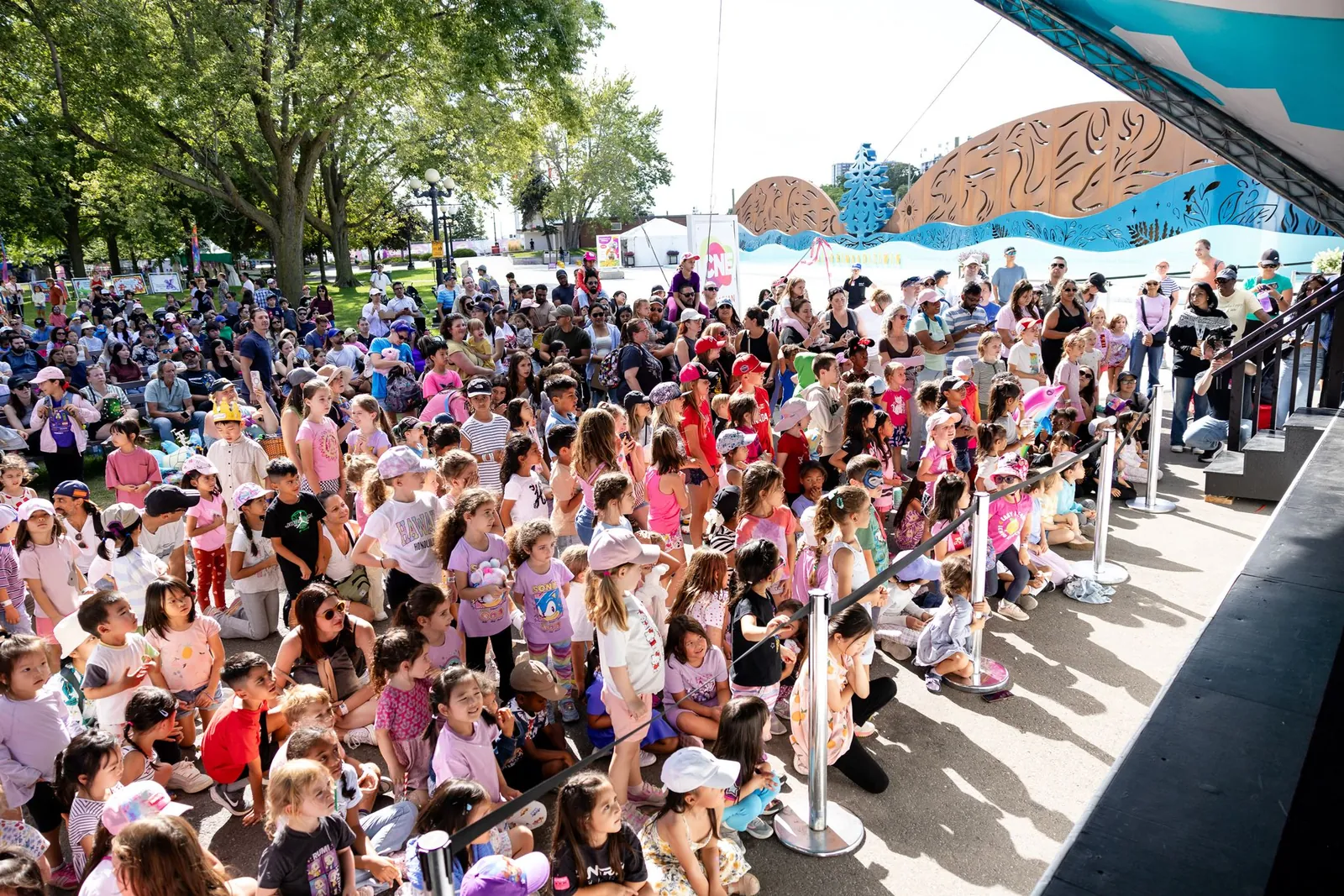 Large crowd of families watching the K-POP Cirque Tribute show