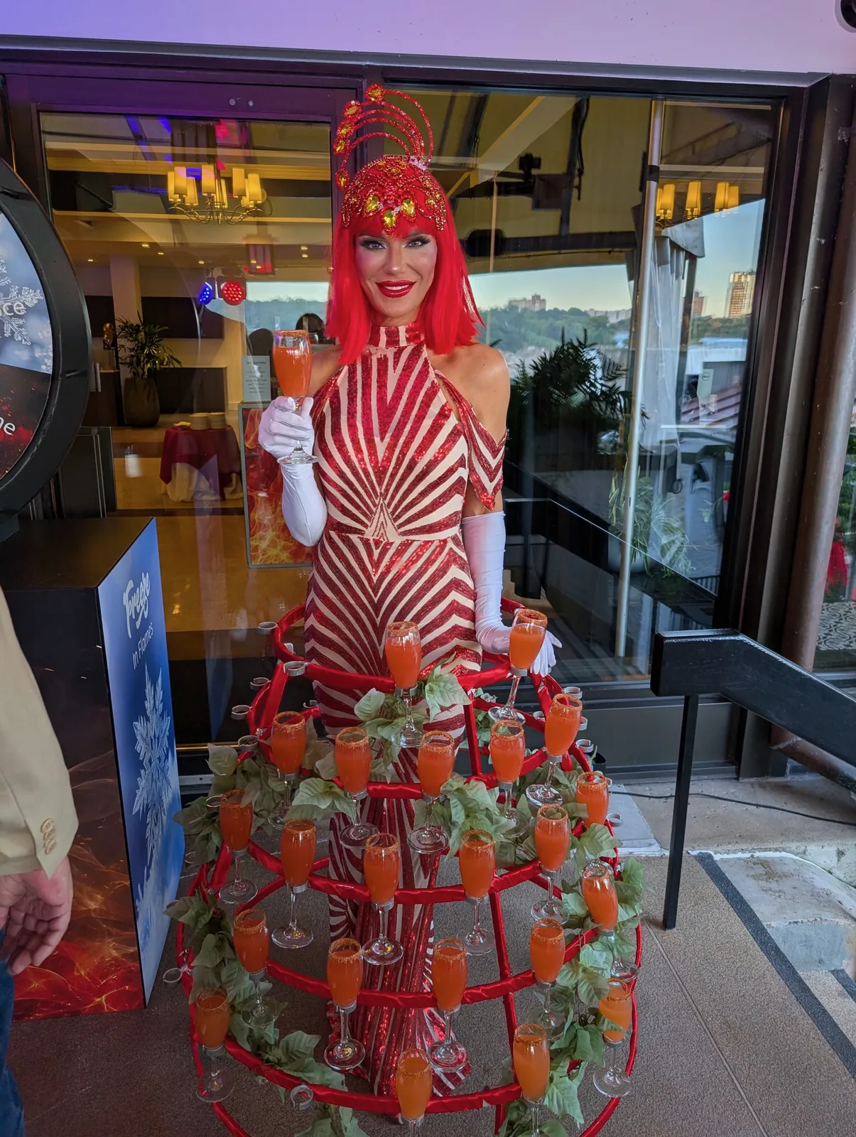 Strolling performer in a red drink-serving dress