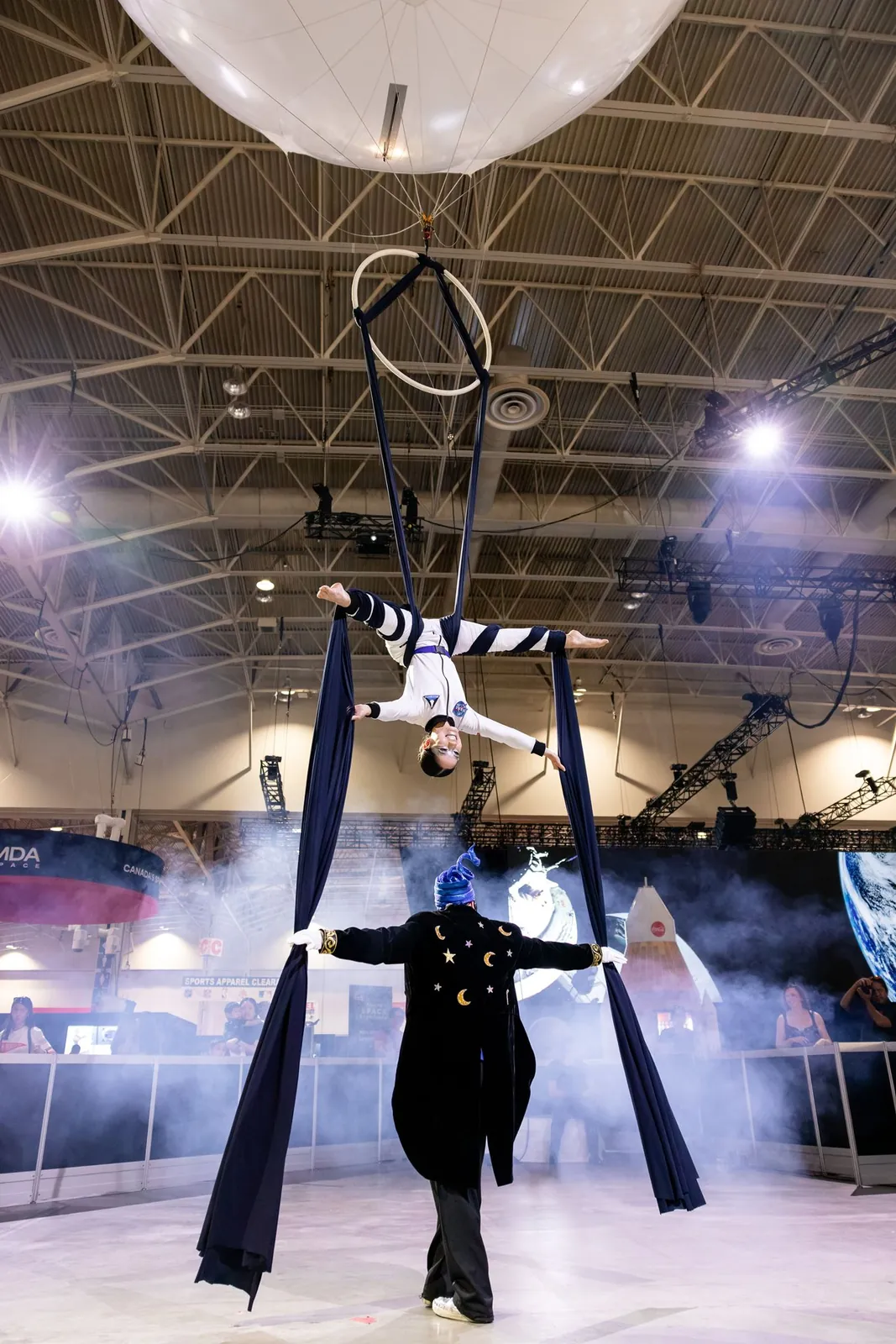 Aerialist performing below the aerial balloon