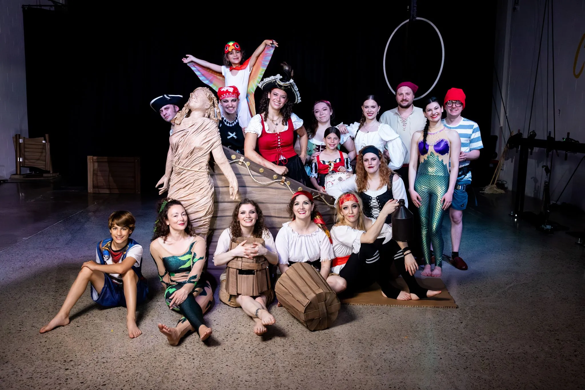 Pirate-themed cast posing together