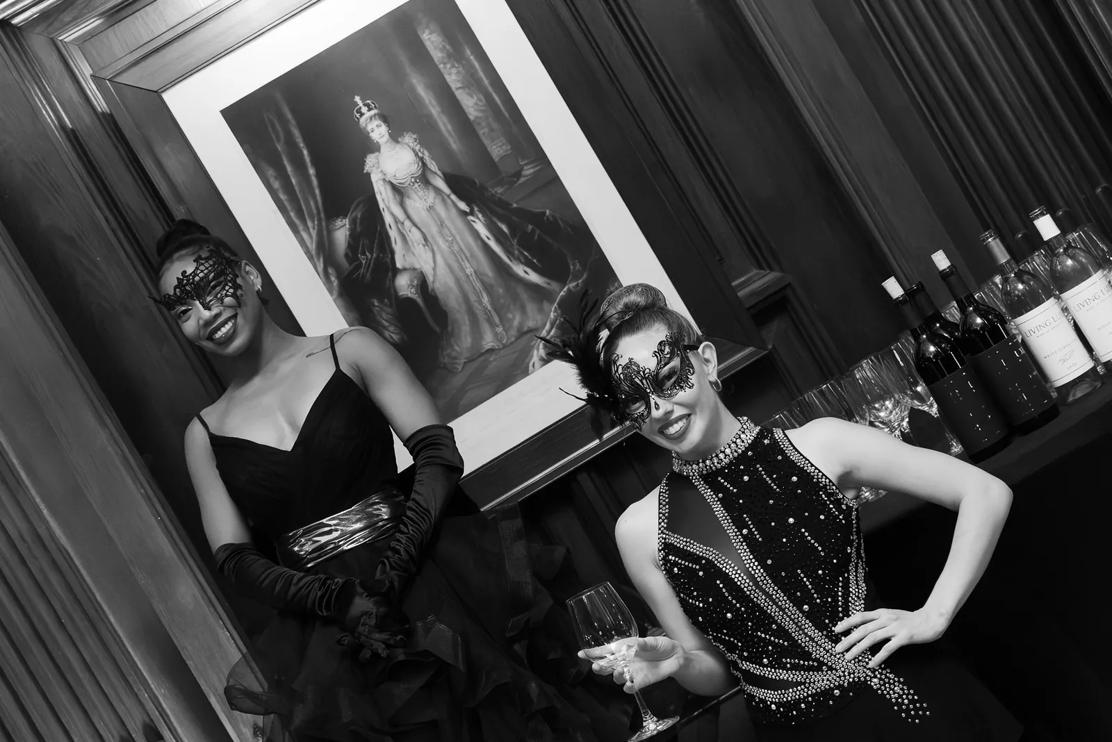 Masquerade performers posing in black and white