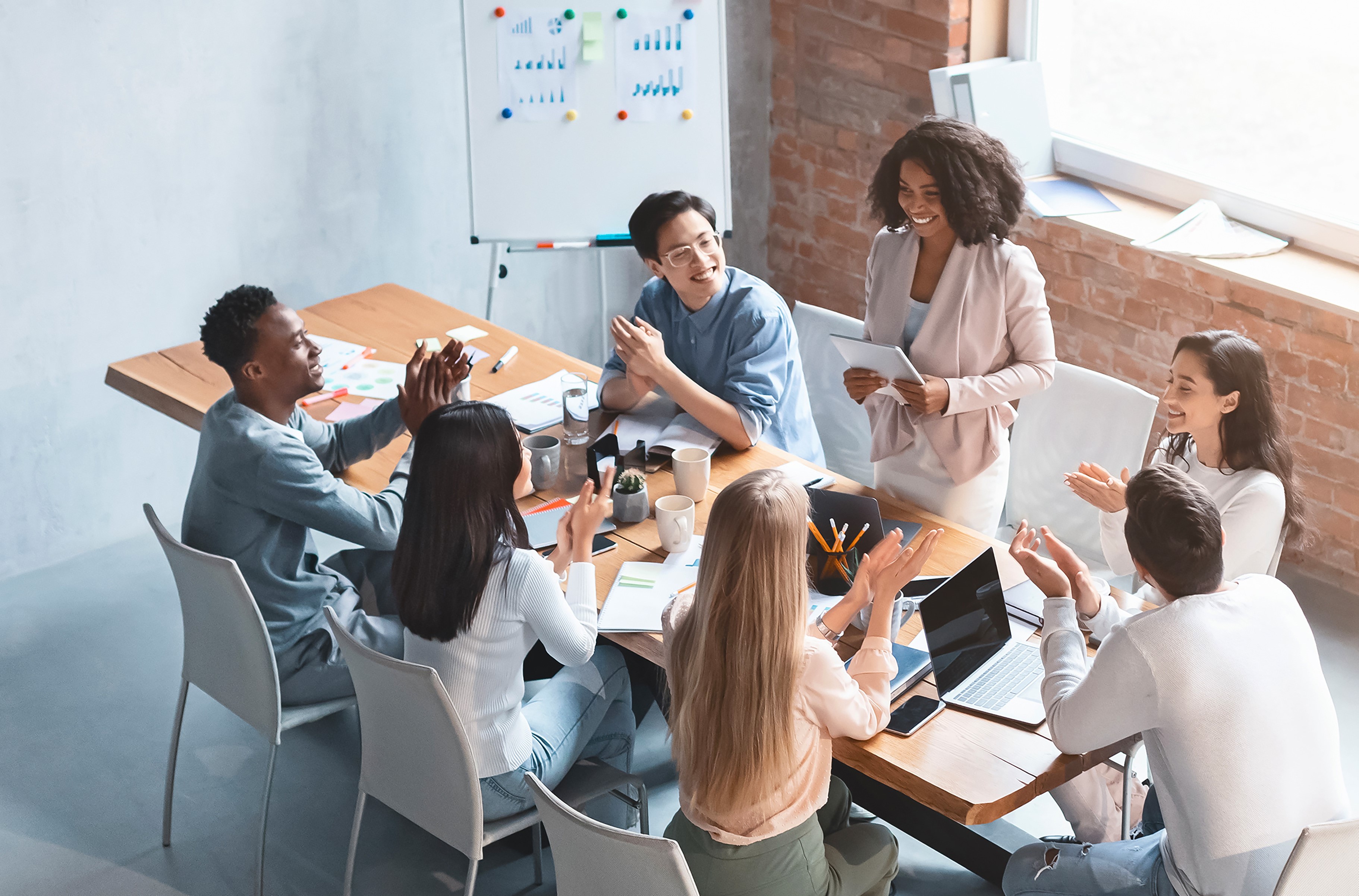 Early-career professionals networking and collaborating in an office setting