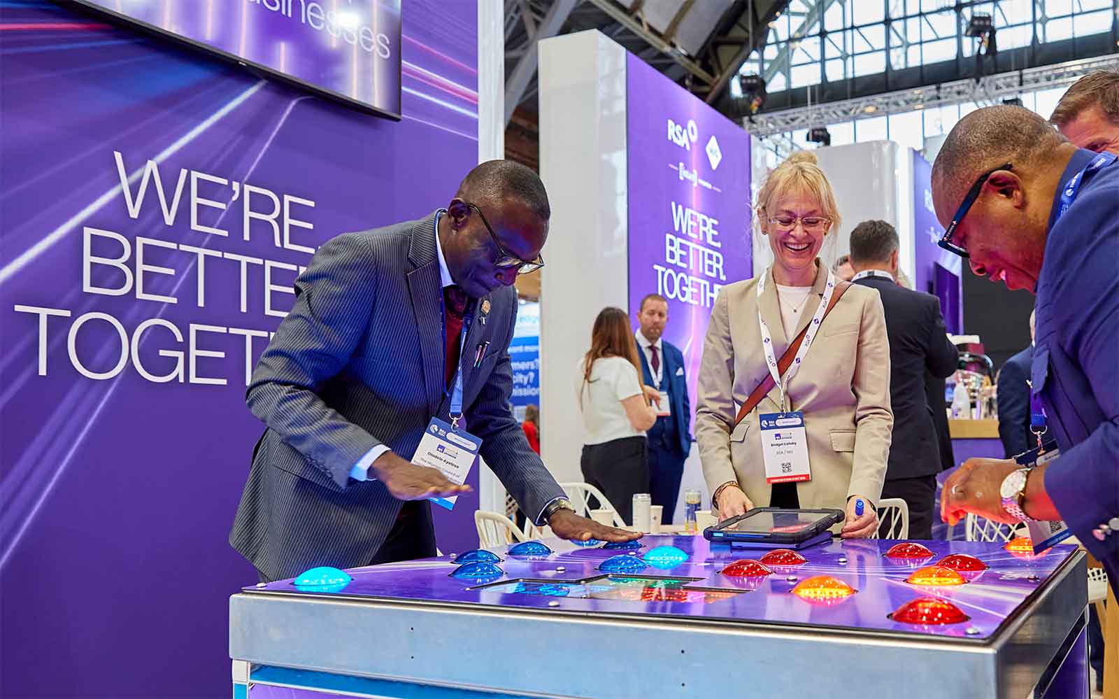 Group playing game at a conference stand