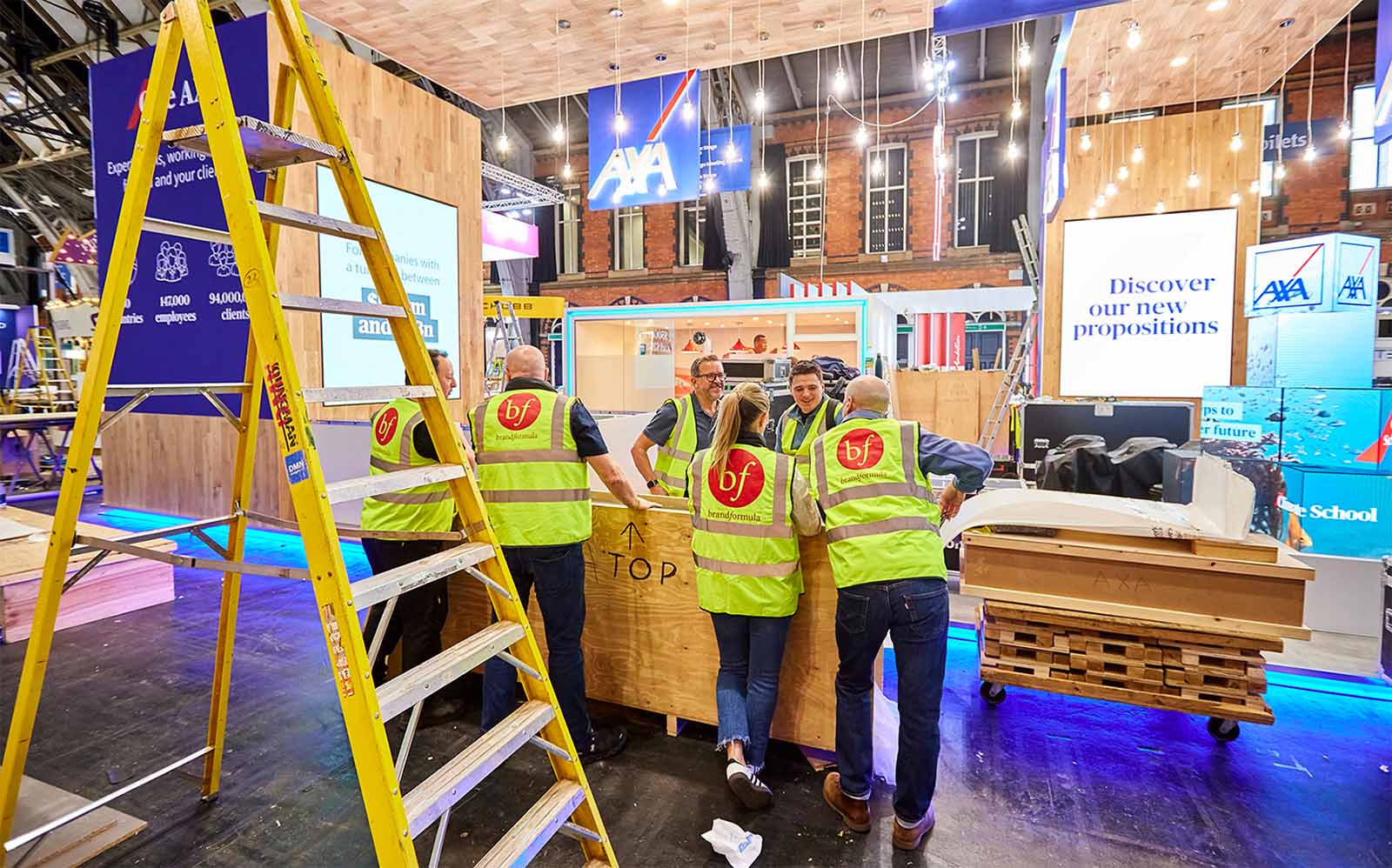 brandformula team discussing the build of a conference stand