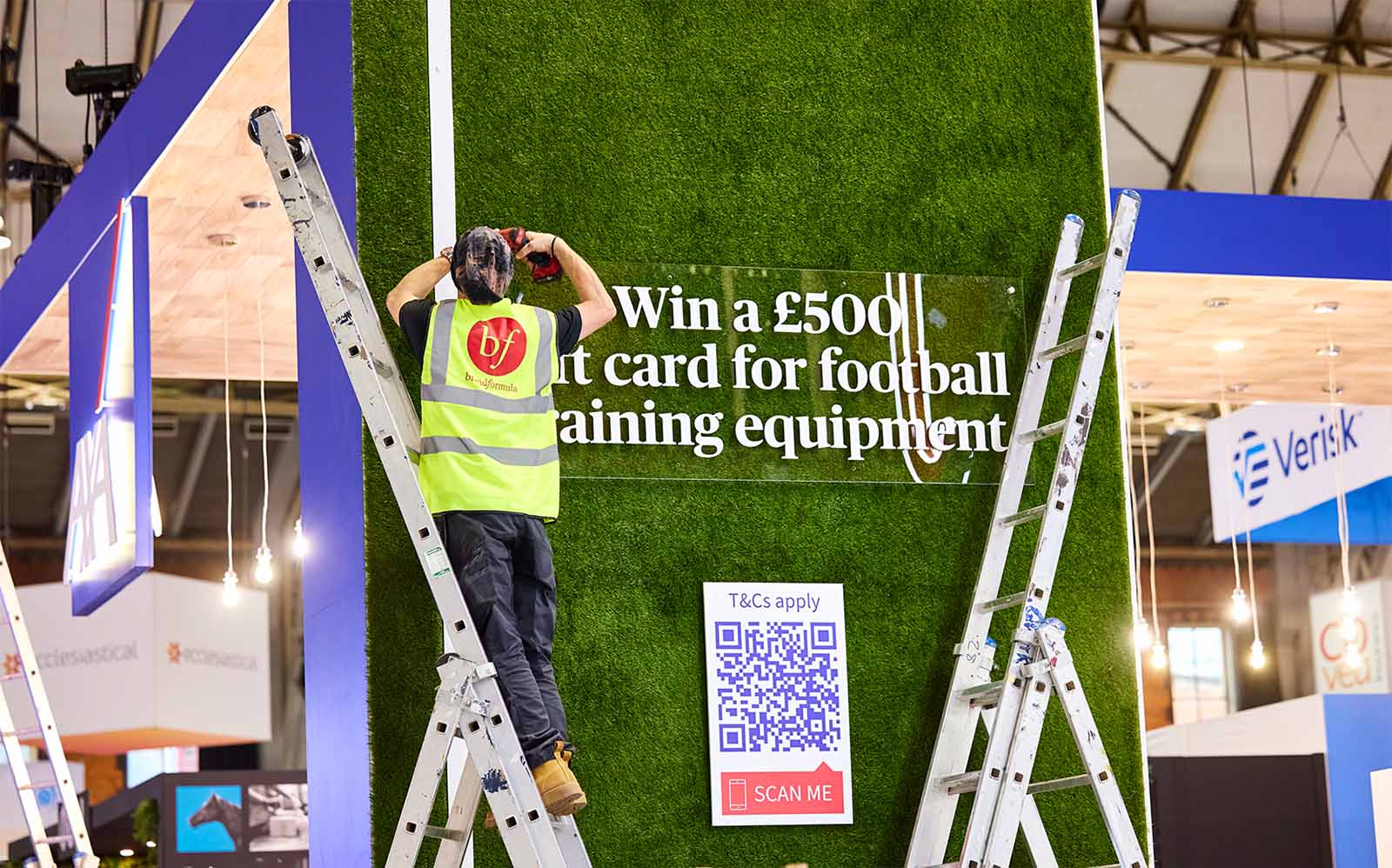 Signage being attached to a conference stand