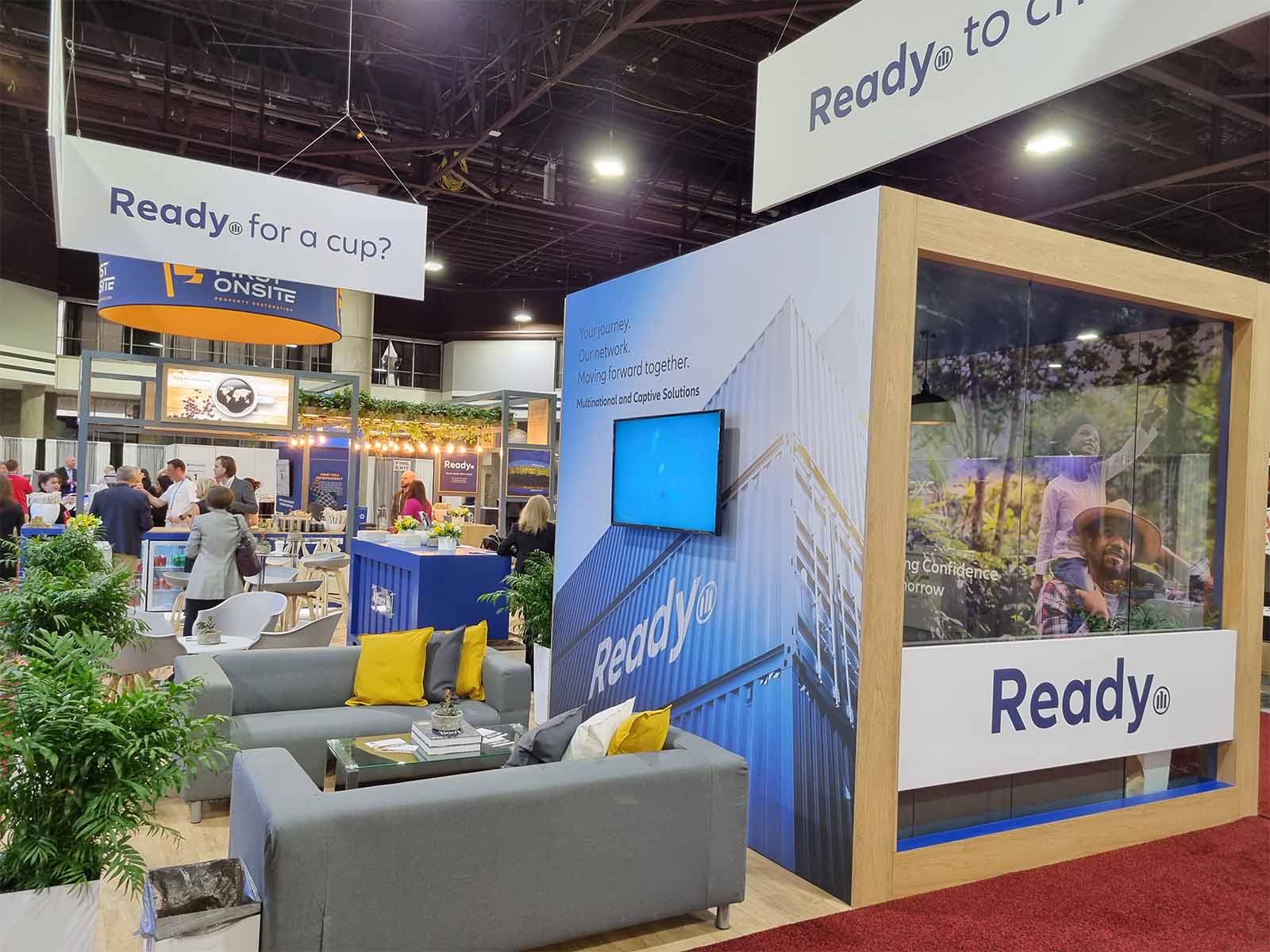 Group playing game at a conference stand