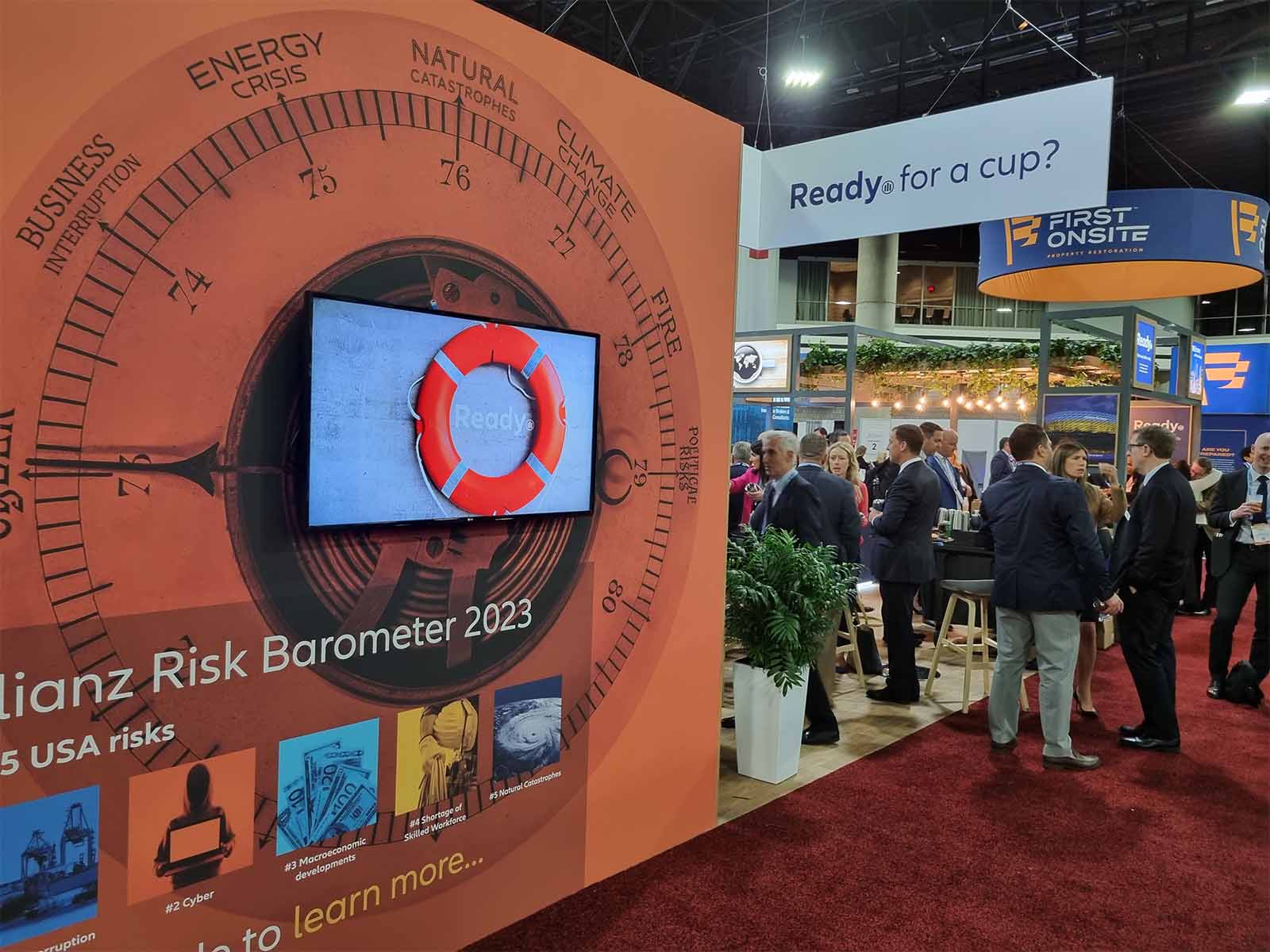 People congregating around a conference stand