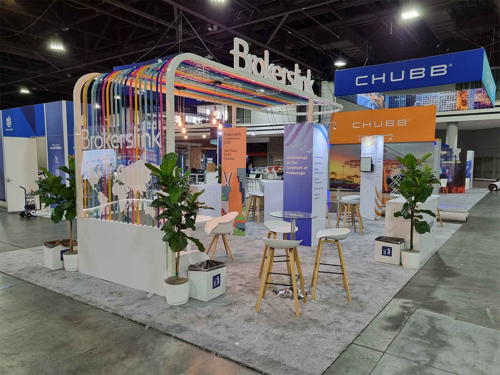 People networking and having discussions on a conference stand