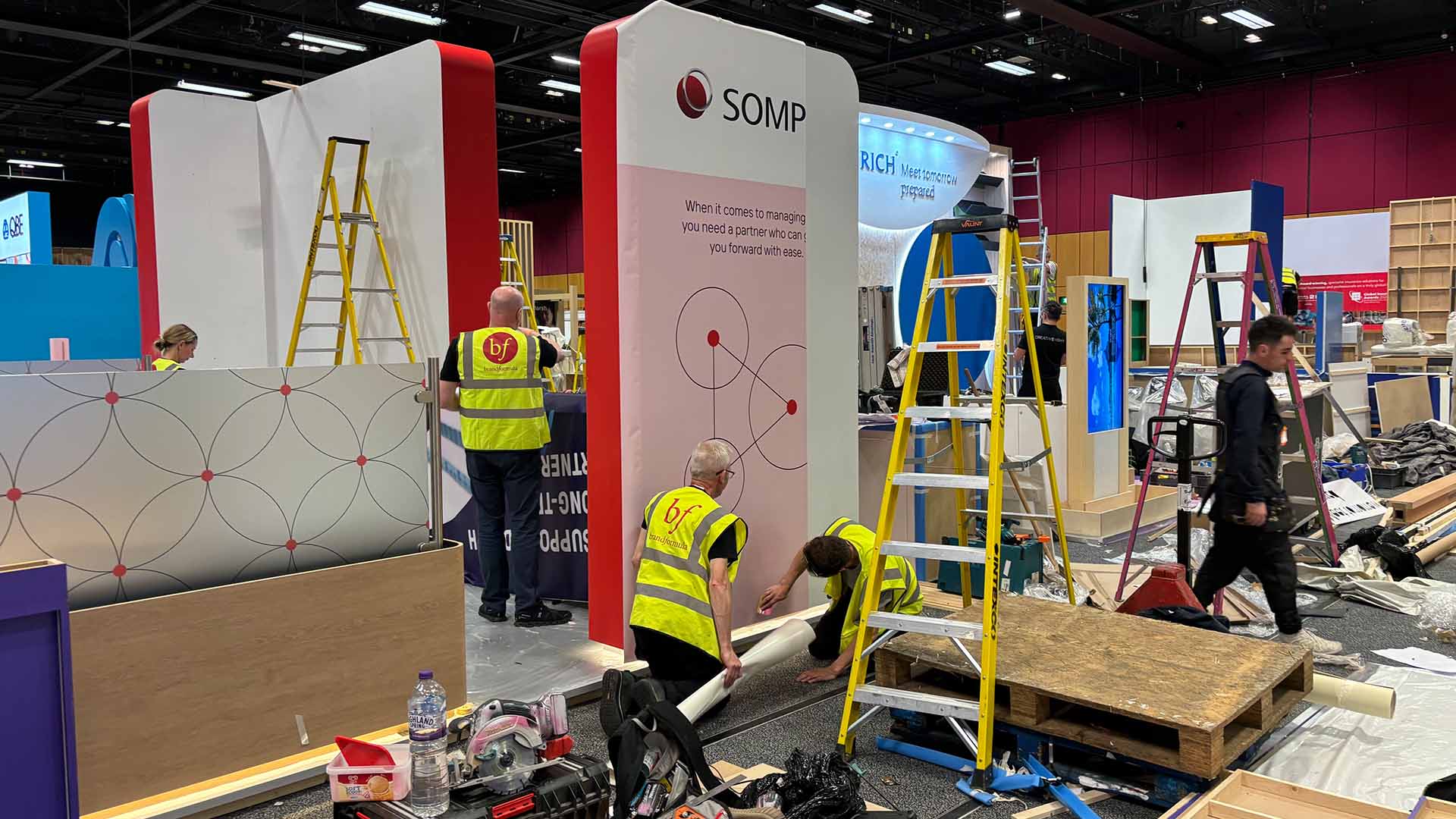 Signage being attached to a conference stand