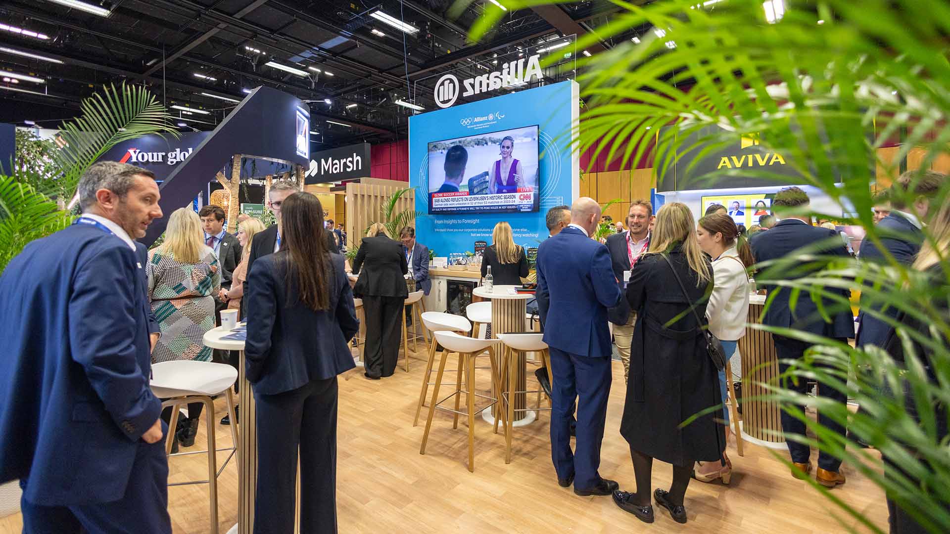 Group having a discussion in the meeting area of a conference stand