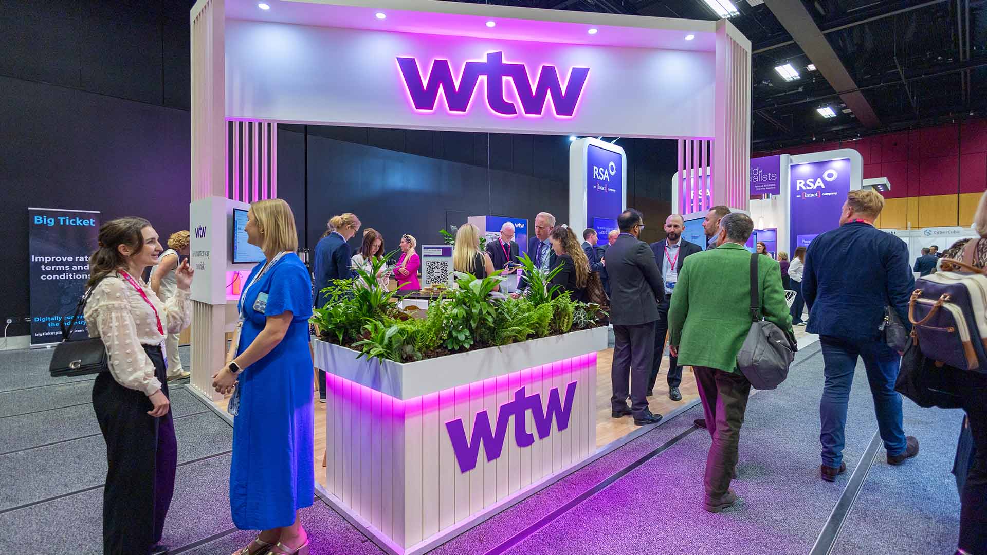 Split image. Left image shows hanging hats on a conference stand. Right image shows a dog in front of a conference stand